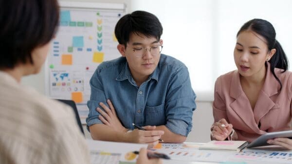 Male and female coworker engaged in learning