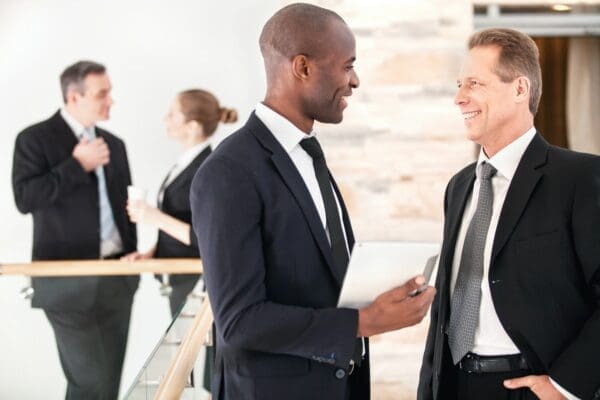 Four business people having conversations at work