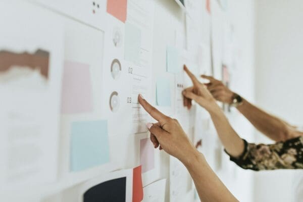 Business people planning a project on a board