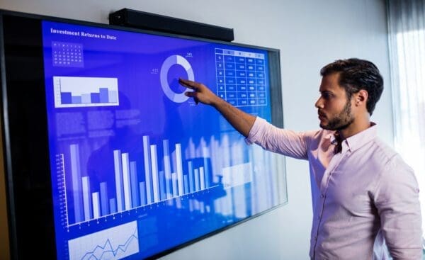 Businessman analyzing data insight with a touch screen