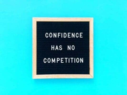 Confidence has no competition quote on felt board with blue background