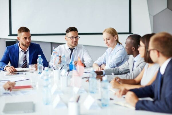 Business training with employees around a circle table