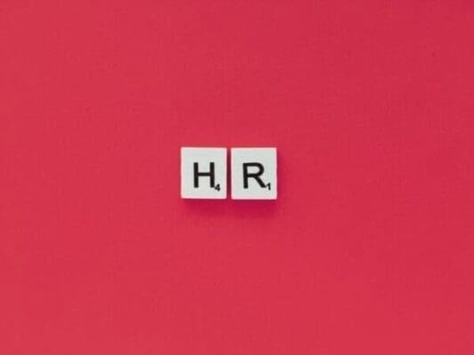 HR letters on a pink background for Human Resource