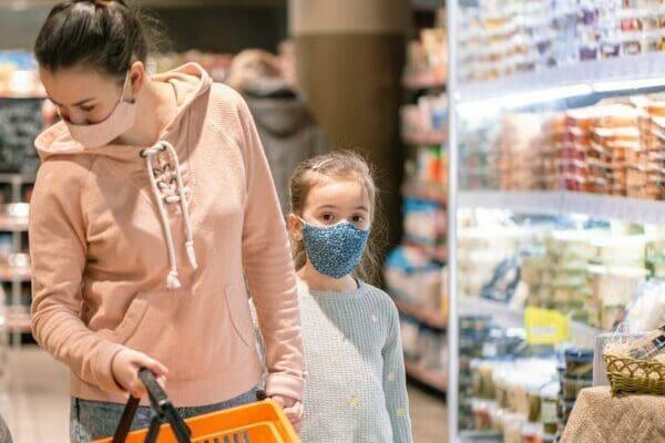 Mom and daughter shopping at the grocery store