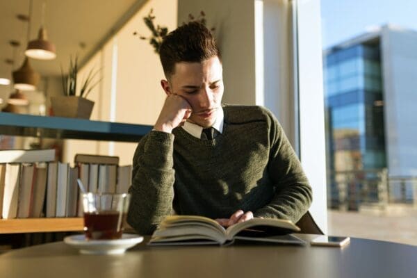Reading Business man reading a book is being proactive