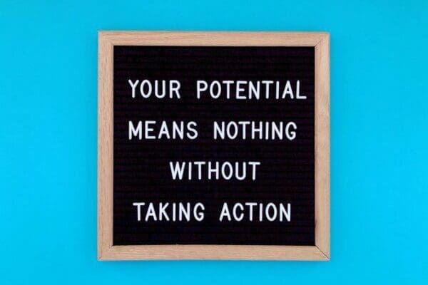 Your potential means nothing without taking action quote on blue background