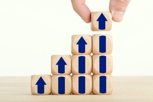 Wooden blocks with upwards arrows on them