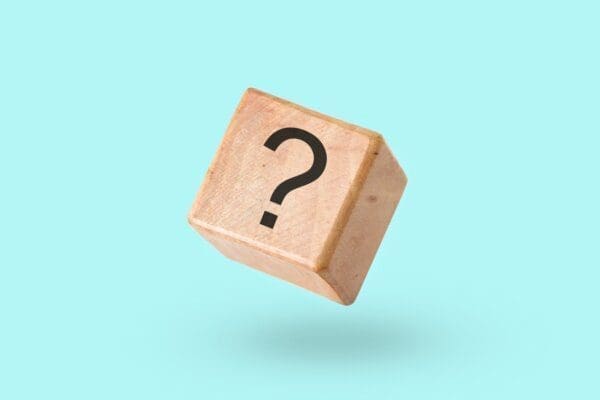 Question mark on a cube with blue background