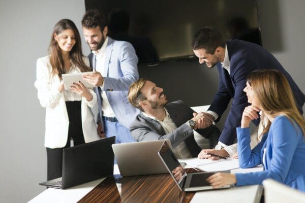 Five team members getting to know each other in an office