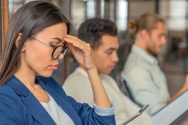 Interviewees sitting in a row while waiting for the interview