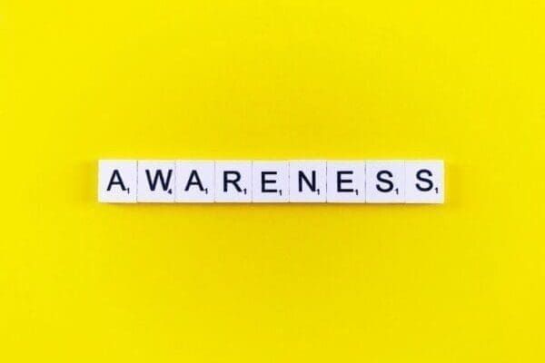 Awareness spelled out on yellow background