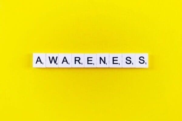 Awareness spelled out on yellow background