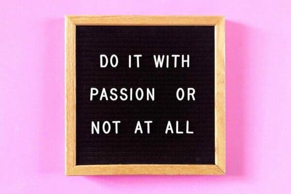 Do it with passion or not at all quote on pink background