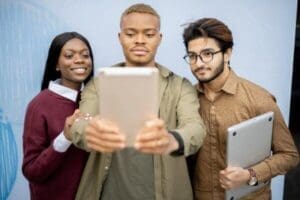 Students having video call on digital tablet is one of the new 2025 Workplace Trends
