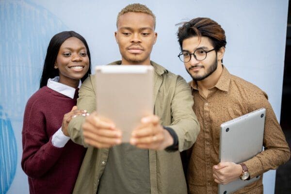 Employees having video call on digital tablet