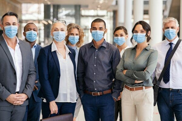 Portrait of multiethnic business people group wearing mask