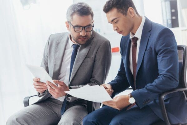 Trainer doing one-to-one training with businessman