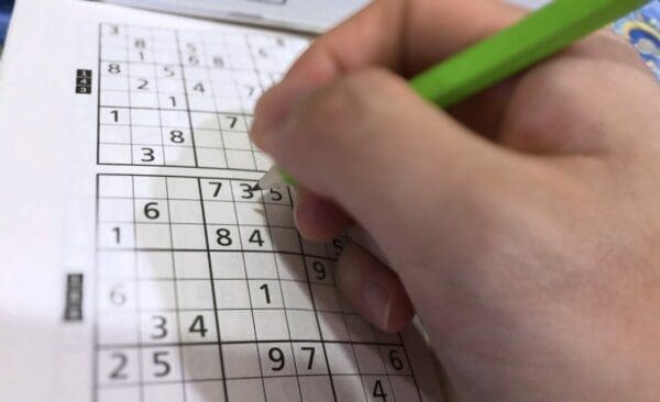 Hand filling in a bingo card