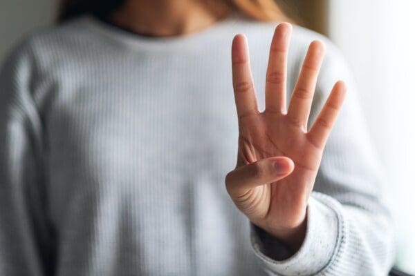 Four fingers entp woman making and showing number four hand sign