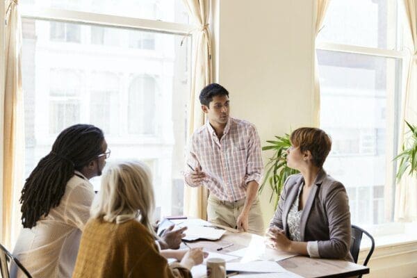 Businessman giving a presentation to colleagues at work