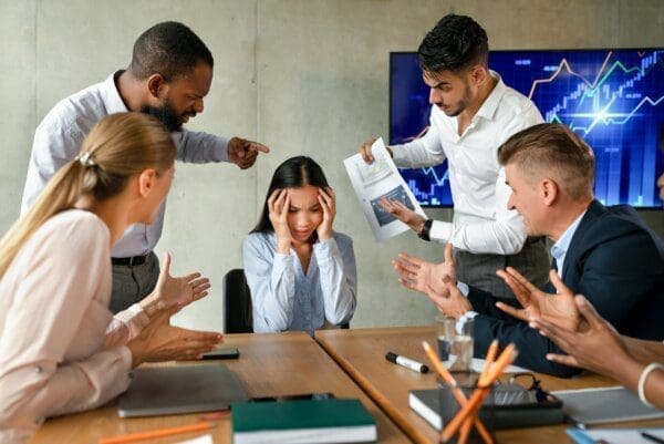 Asian worker stressed by conflict in the workplace