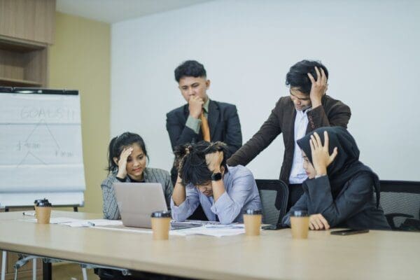 Frustrated team of business people in the office