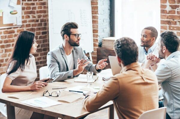 Team around a table making decisions 