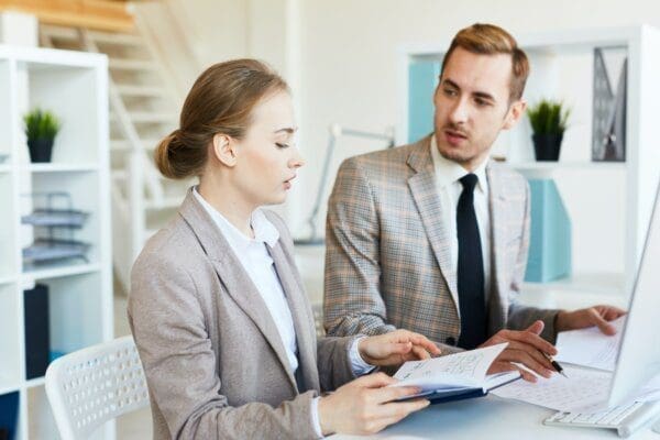 Businesswoman with her male business manager