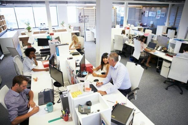 Office of employees Birdseye's view of many HR employees working in a big office represents shared HR service