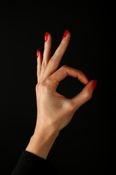Precision grip Woman's hand with thumb and forefinger closed in a circle.