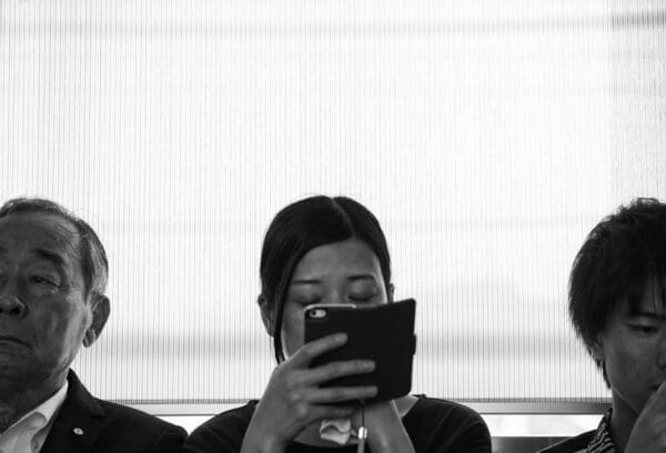 Ignoring on phone Person on their phone ignoring others aroundher