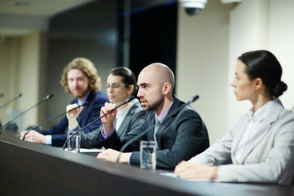 Panel of businesspeople at a political conference