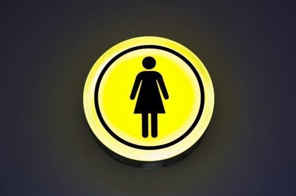 Black INTP female icon inside a yellow neon circle