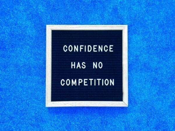 Confidence quote Confidence has no competition quote on felt board and blue background for persuasion technique