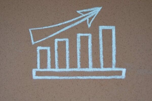 Growth chart Chalk drawing on a bar graph with an upwards arrow