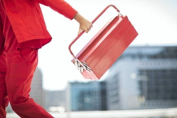 Worker with tool box dressed in red