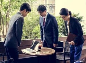 Japanese businesspeople greeting with bowing gesture to display respectful body language