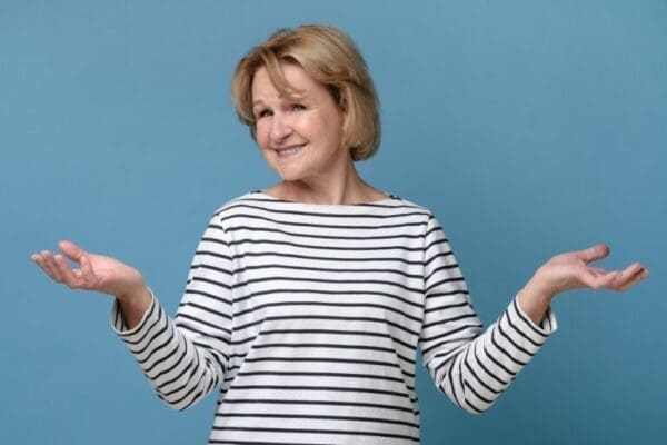 compare two options Senior caucasian woman choosing between two options