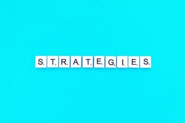 strategies spelt with white word scramble tiles on light blue background