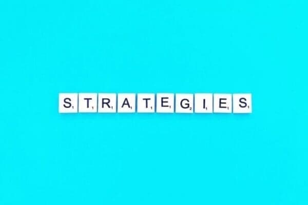 strategies spelt with white word scramble tiles on light blue background