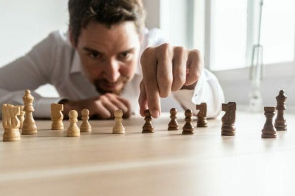 Manager creating employee retention strategy with chess