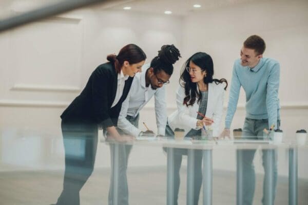 Female manager using Participative Management with her employee coworkers