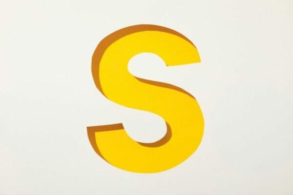 Yellow letter S on white background