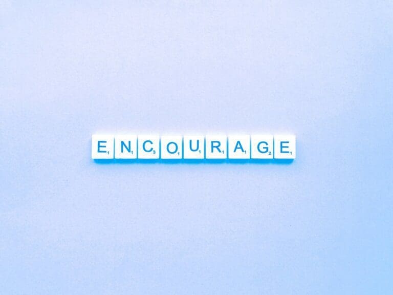encourage encourage spelled on light blue background