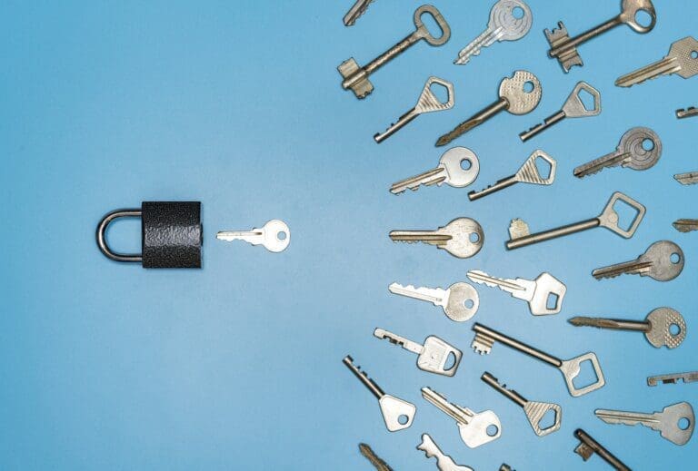 Keys Black lock with many keys on a blue surface