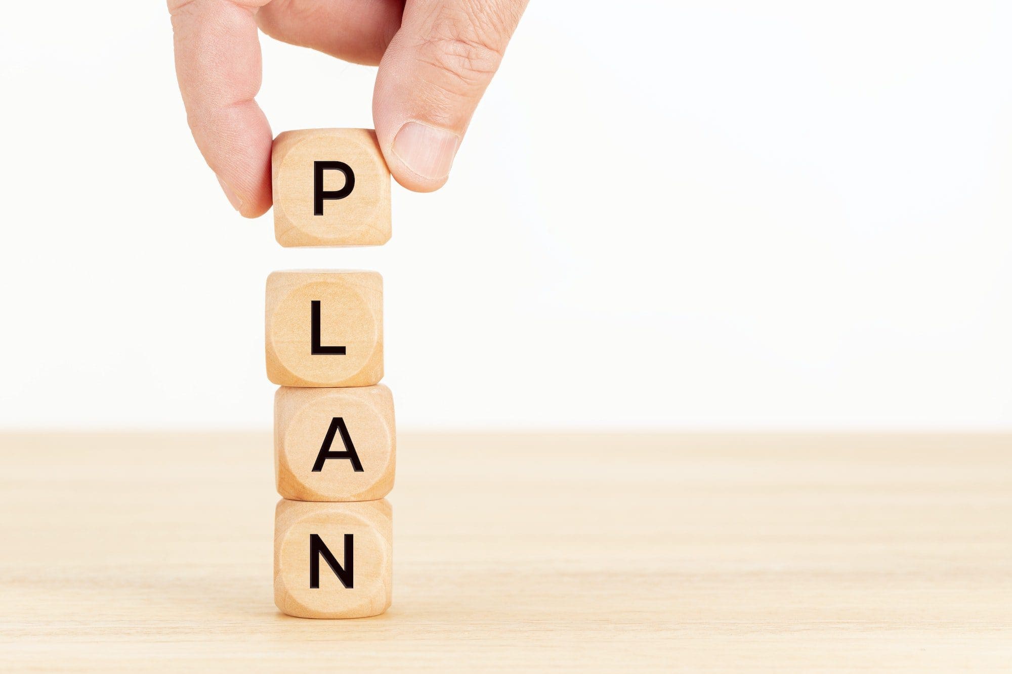 Plan Plan spelled with wooden cubes
