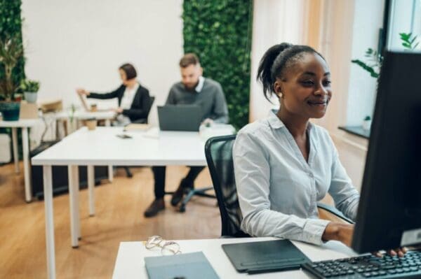 Manager working on a computer in a creative work environment