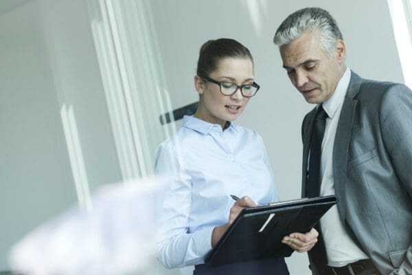 Female Manager discussing with assistant