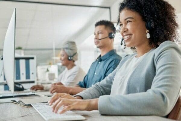 Happy Black woman in a call center jod displays job satisfaction