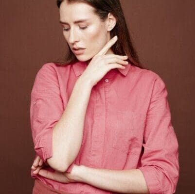 Vulnerable woman in pink shirt and skirt